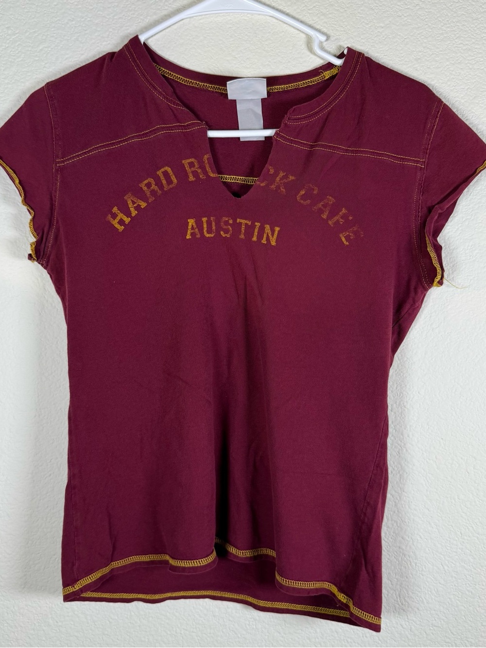 Vintage Hard Rock Cafe burgundy tee with yellow logo stitching Austin